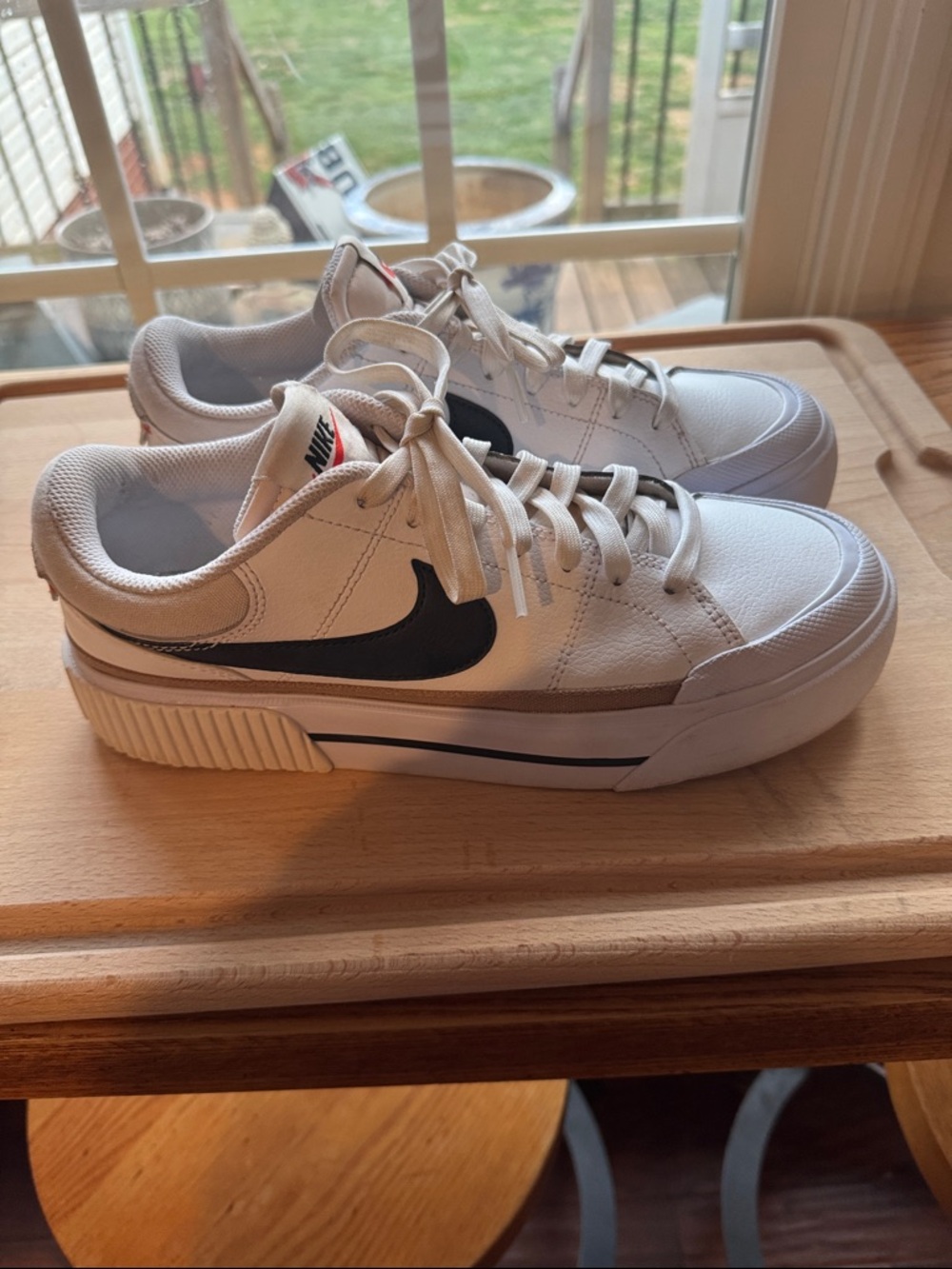 Nike White Sneakers with Black Swoosh and Tan Stripe